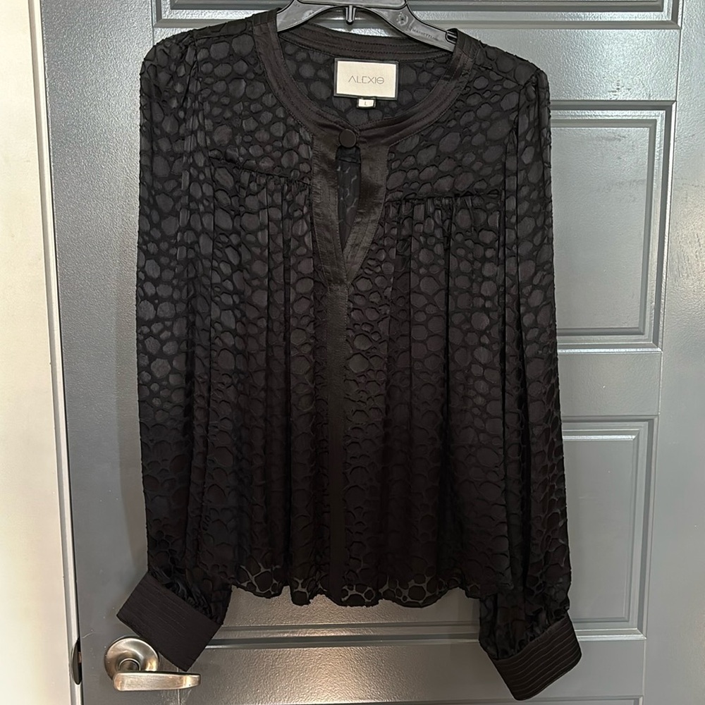 ALEXIS semi-sheer leopard blouse.